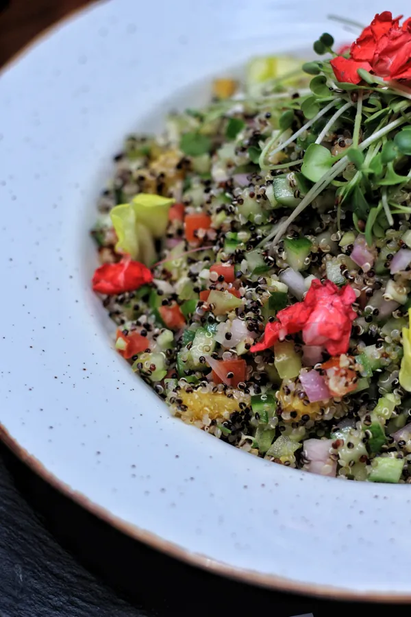 Fresh salad with herbs and edible flowers
