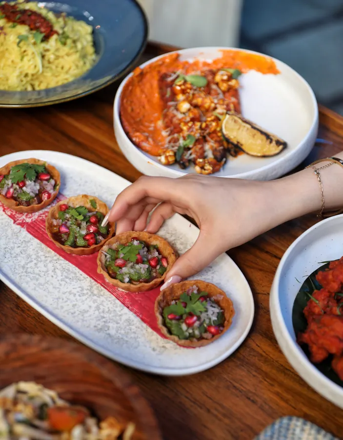 A colourful spread of tacos and restaurant dishes