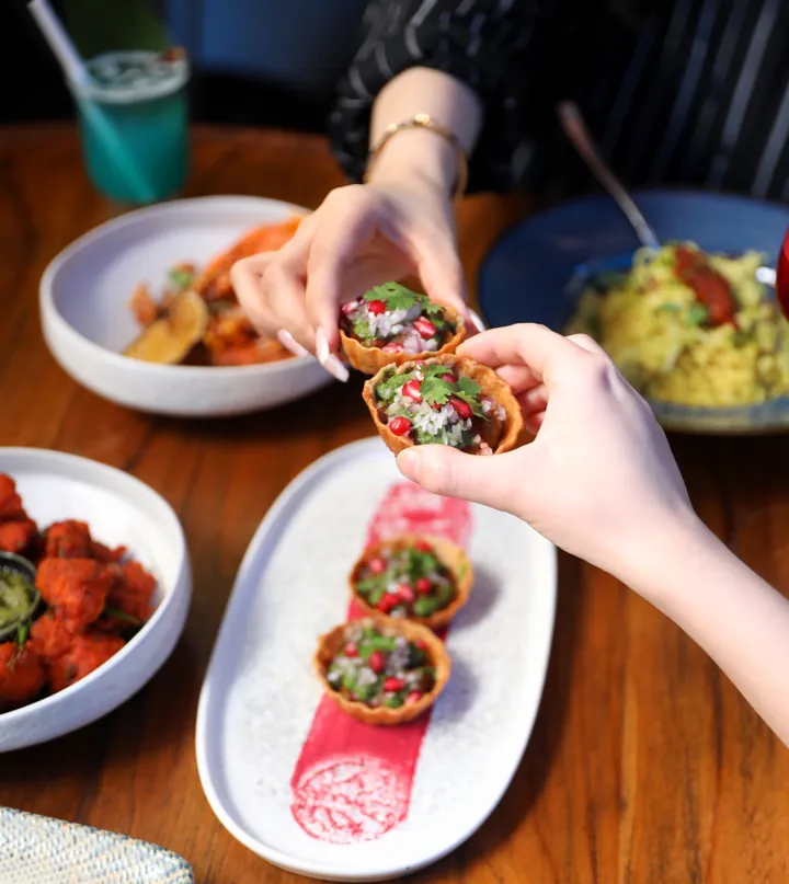 Sharing tacos around a restaurant table